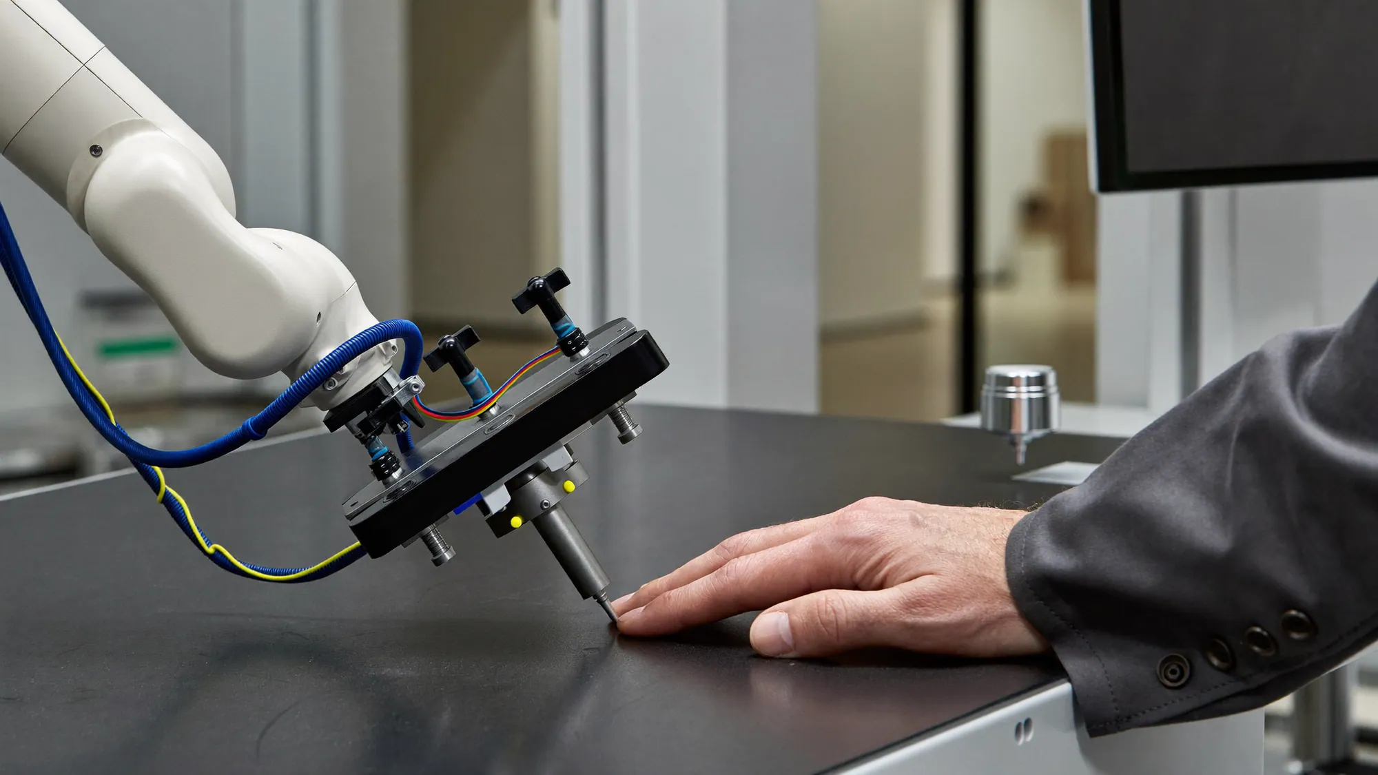 A collaborative robot working alongside a human hand, comparing AI vs automation