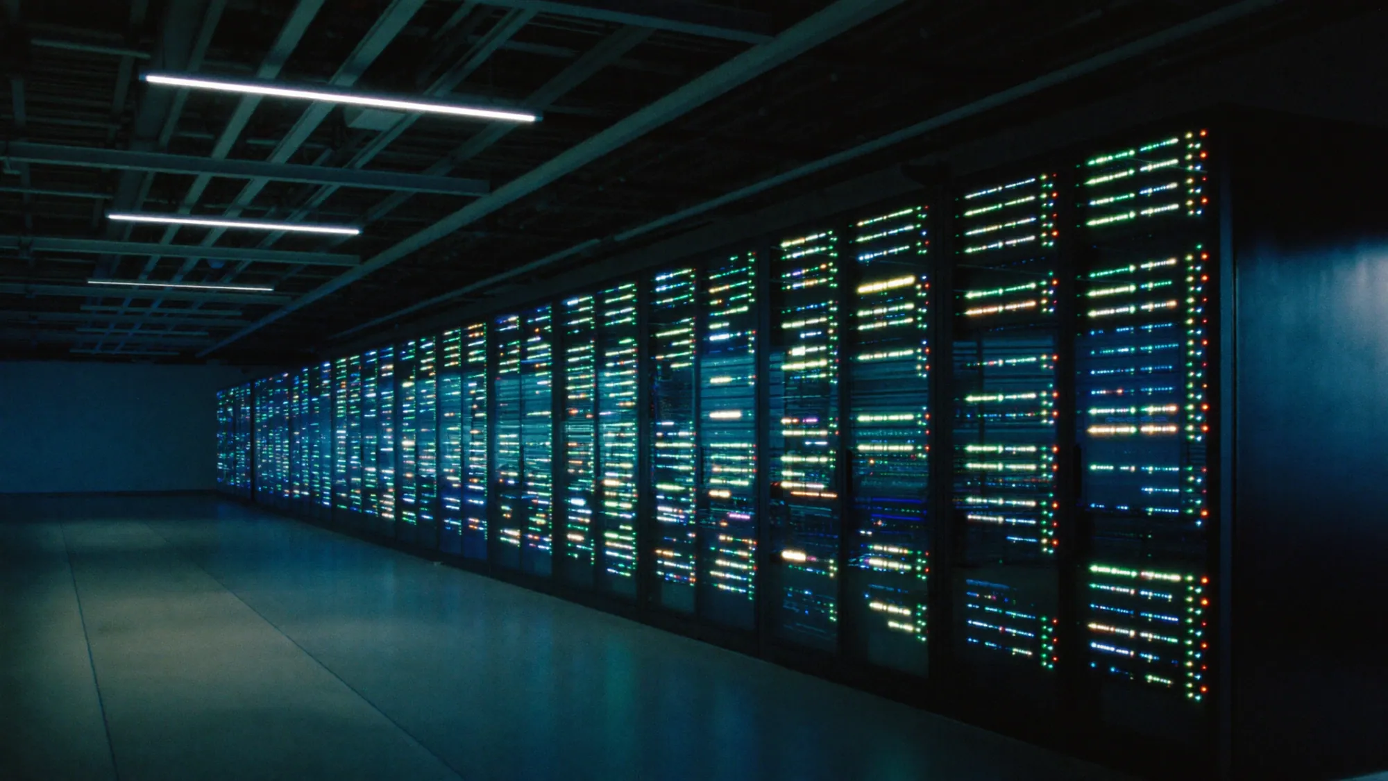 Rows of glowing server racks in a data center, comparing AWS vs Azure vs GCP for a cloud migration