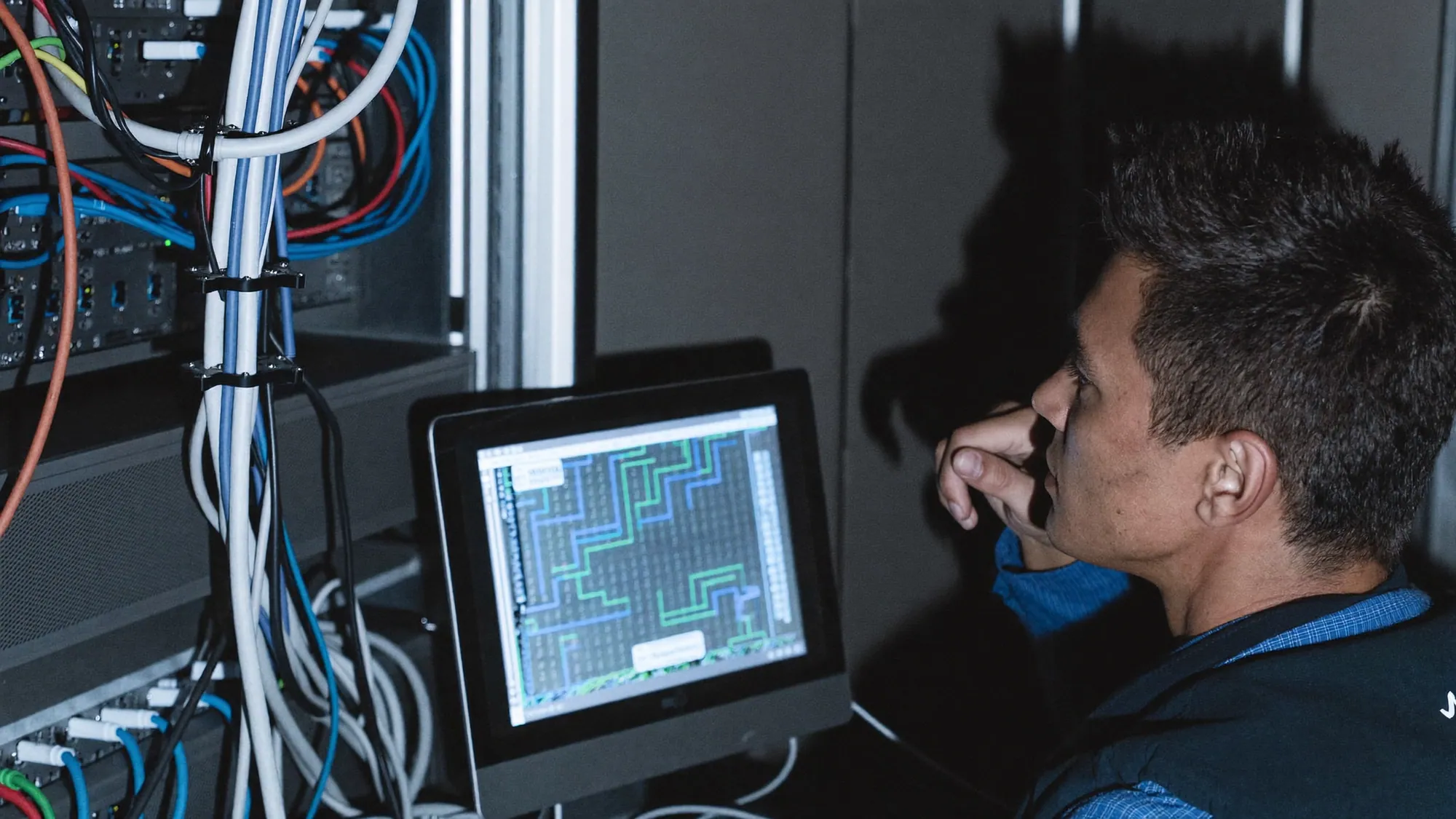 A data engineer at infrastructure, illustrating data engineering vs data analytics