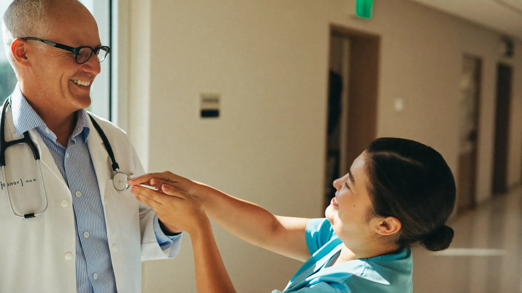 A doctor and nurse collaborating in a hospital, digital transformation in healthcare