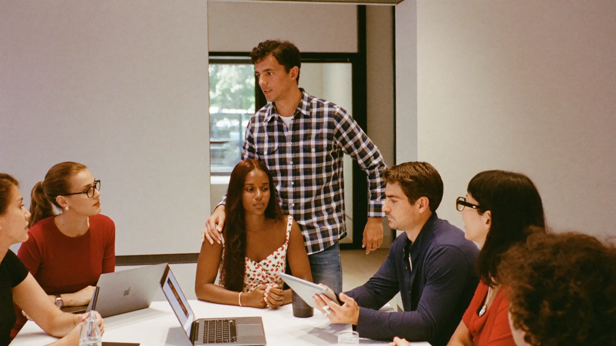A diverse team of consultants in a strategy meeting, top digital transformation consulting firms