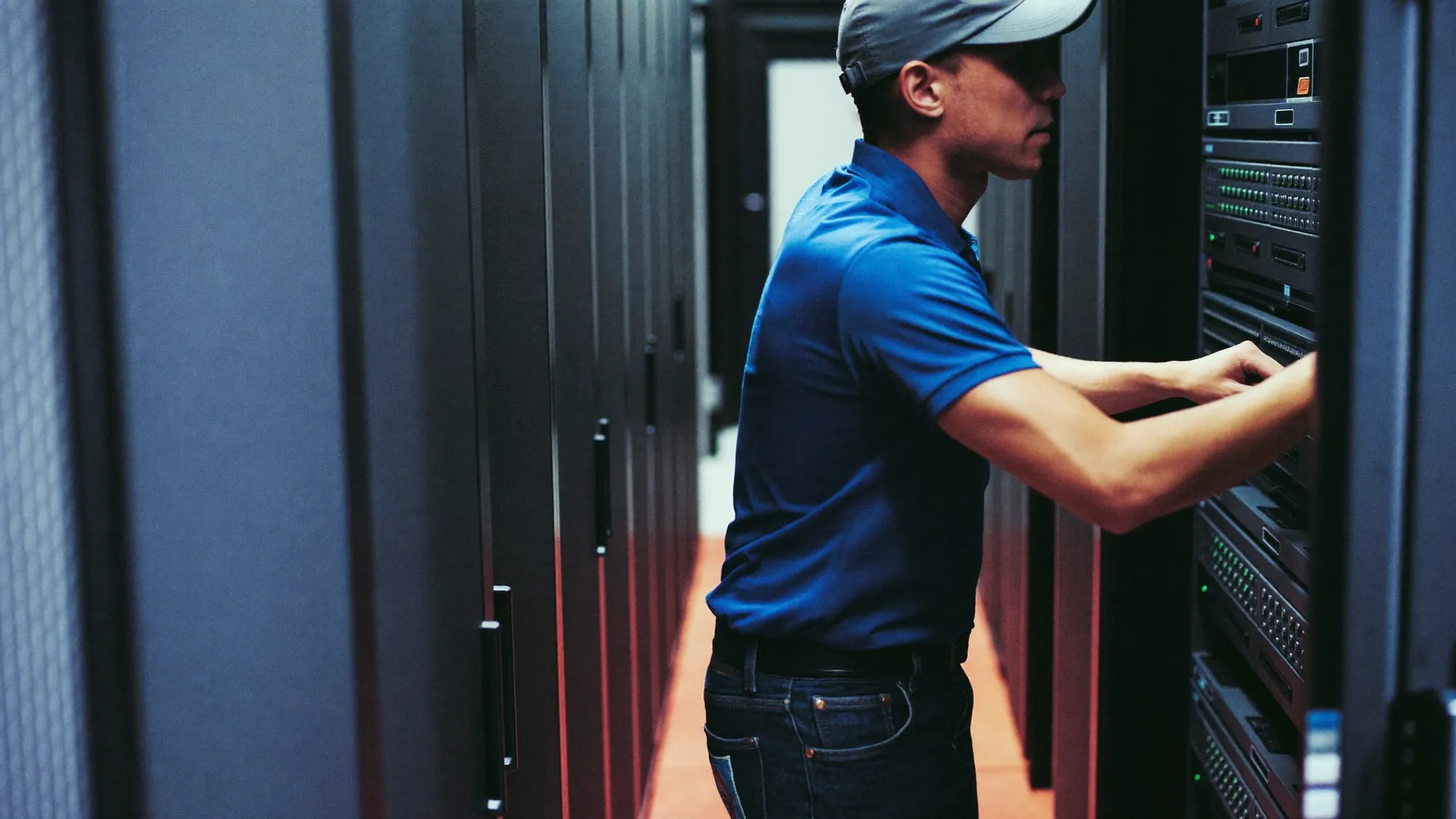 An IT engineer working on servers, illustrating what legacy system modernization is