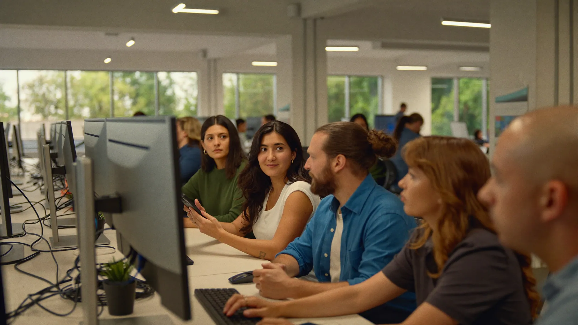 Diverse Latino software development team collaborating in a modern Monterrey, Mexico office — a top nearshore partner for US companies