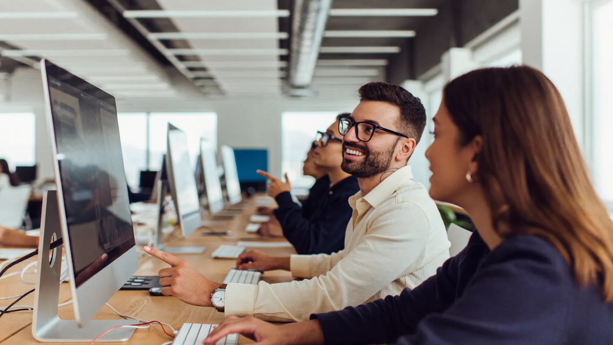 A sales team collaborating and using their CRM together during an adoption-first rollout