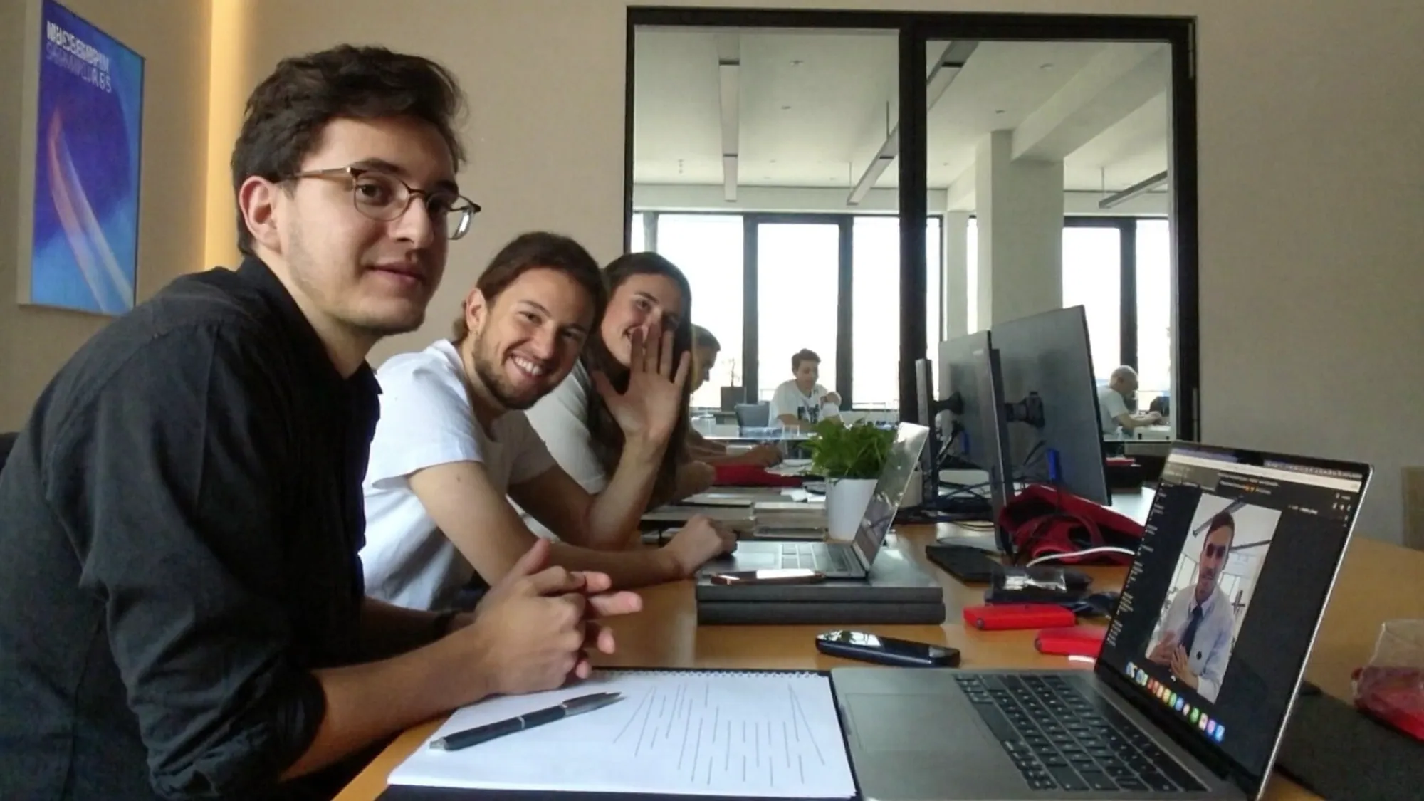 A nearshore team on a live video call with a remote US teammate during the same working hours, showing real-time collaboration